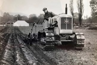 Bert French on plough